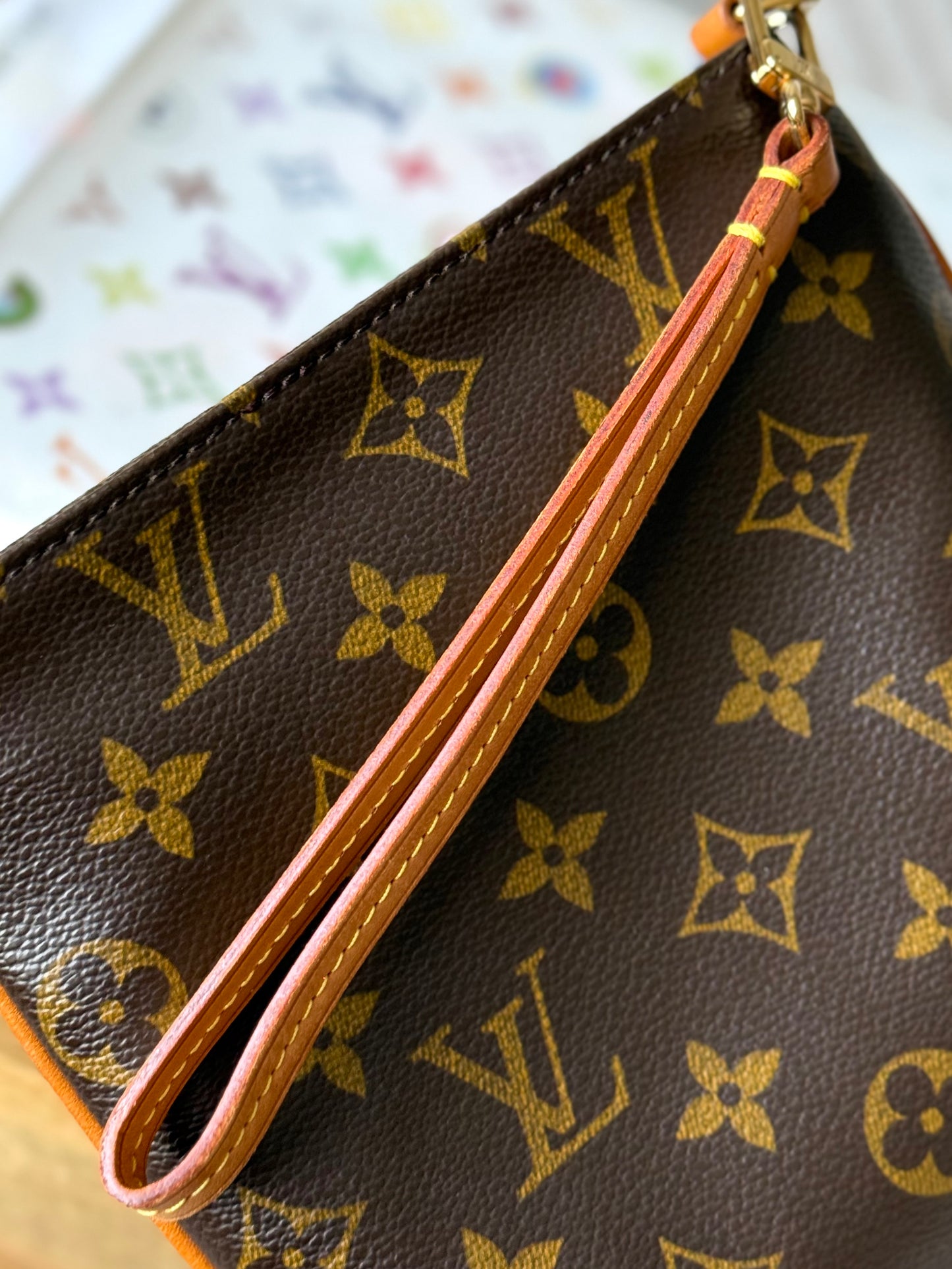 LV Partition Wristlet Pouch.