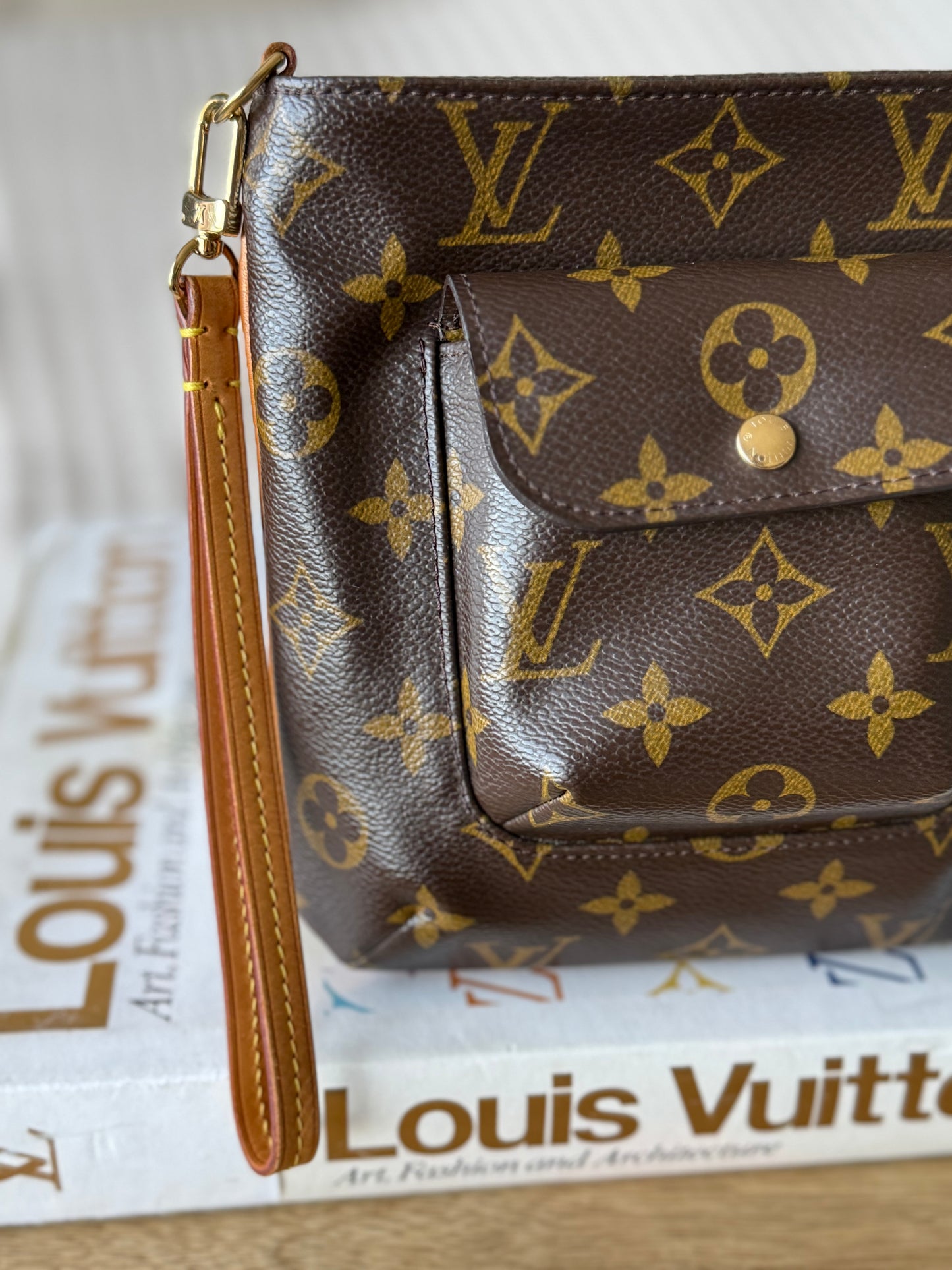 LV Partition Wristlet Pouch.